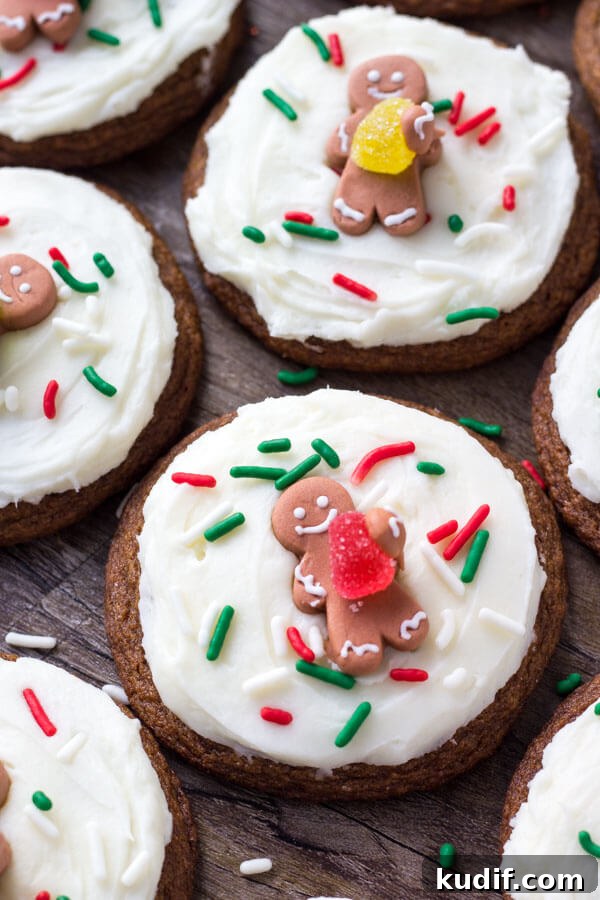 These easy gingerbread cookies are soft, chewy & perfect for the holidays. It's a no chill recipe - so they take way less time to make than regular gingerbread cookies. Then they're topped with fluffy cream cheese frosting.