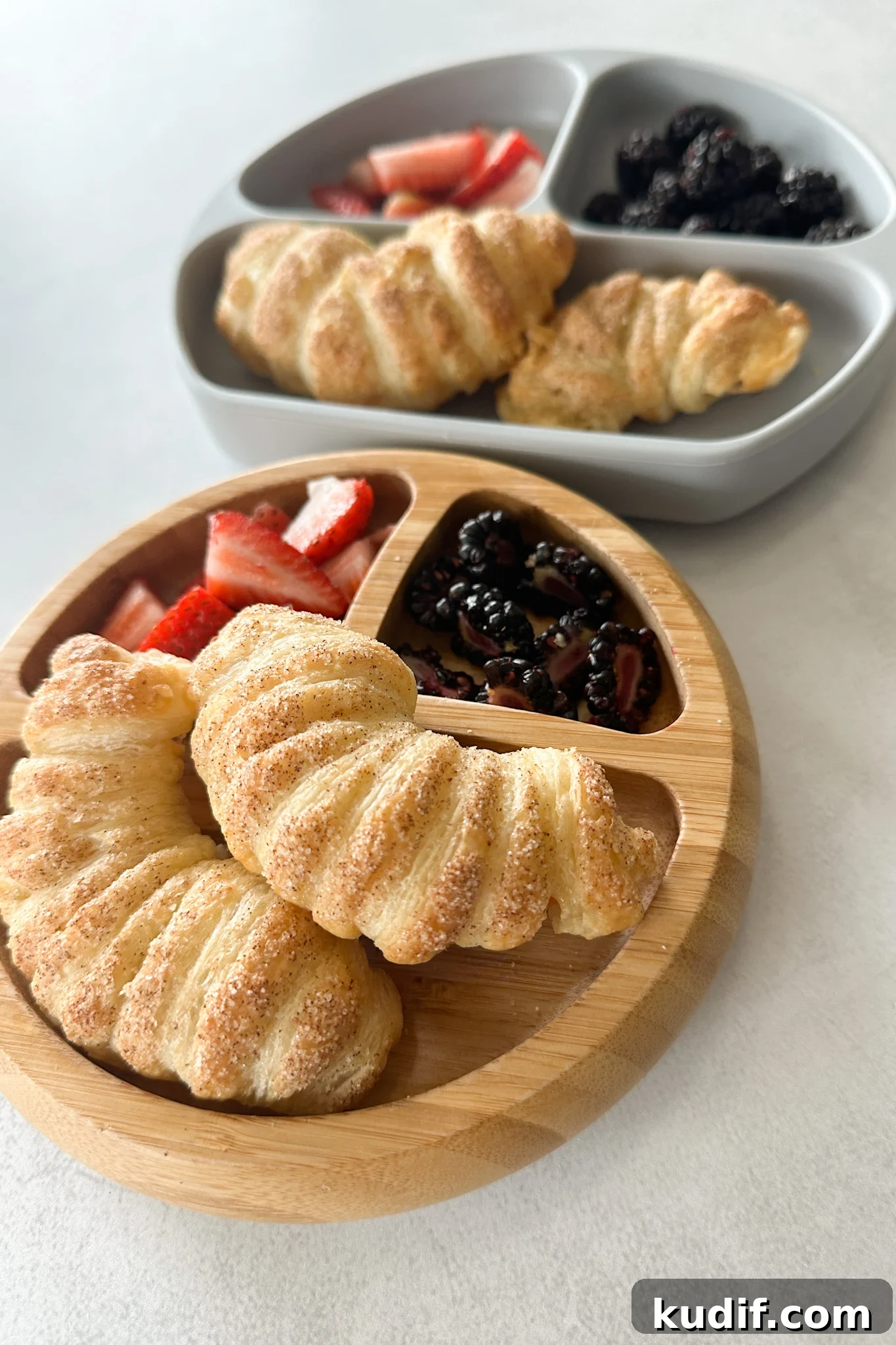 Apple croissants served with berries.