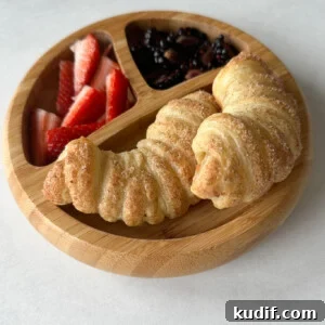 Apple croissants served with berries.