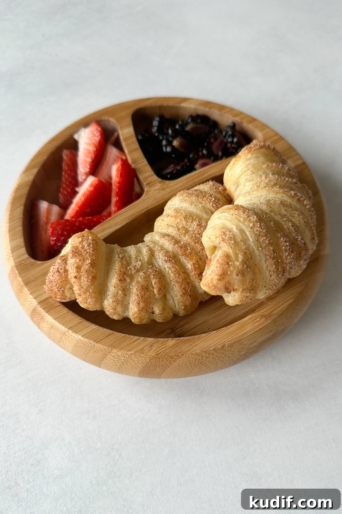 Apple croissants served with berries.