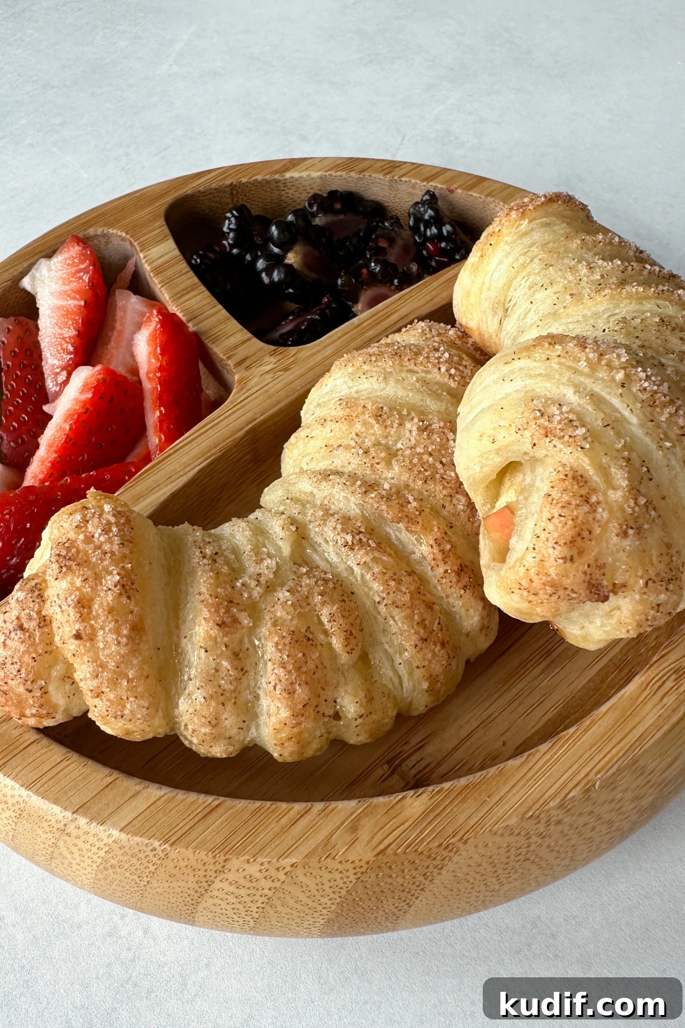 Apple croissants served with berries.