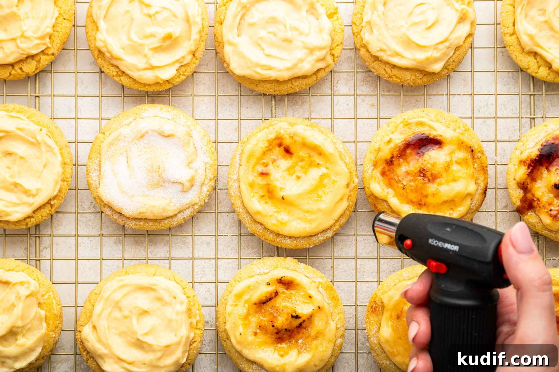 Crème Brûlée Cookie Recipe: Crispy Edges, Gooey Center 11 Hand using culinary torch to toast tops of cookies.