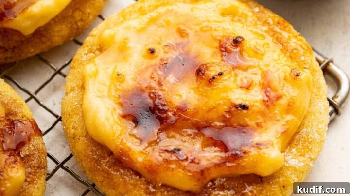Creme brulee cookies with brown crispy topping on a wire rack.
