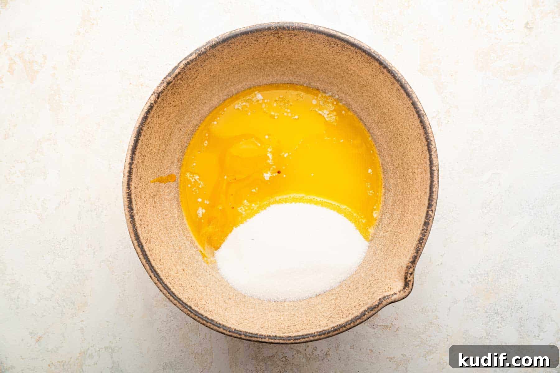 Crème Brûlée Cookie Recipe: Crispy Edges, Gooey Center 5 Melted butter, egg yolks and granulated sugar in a brown bowl.
