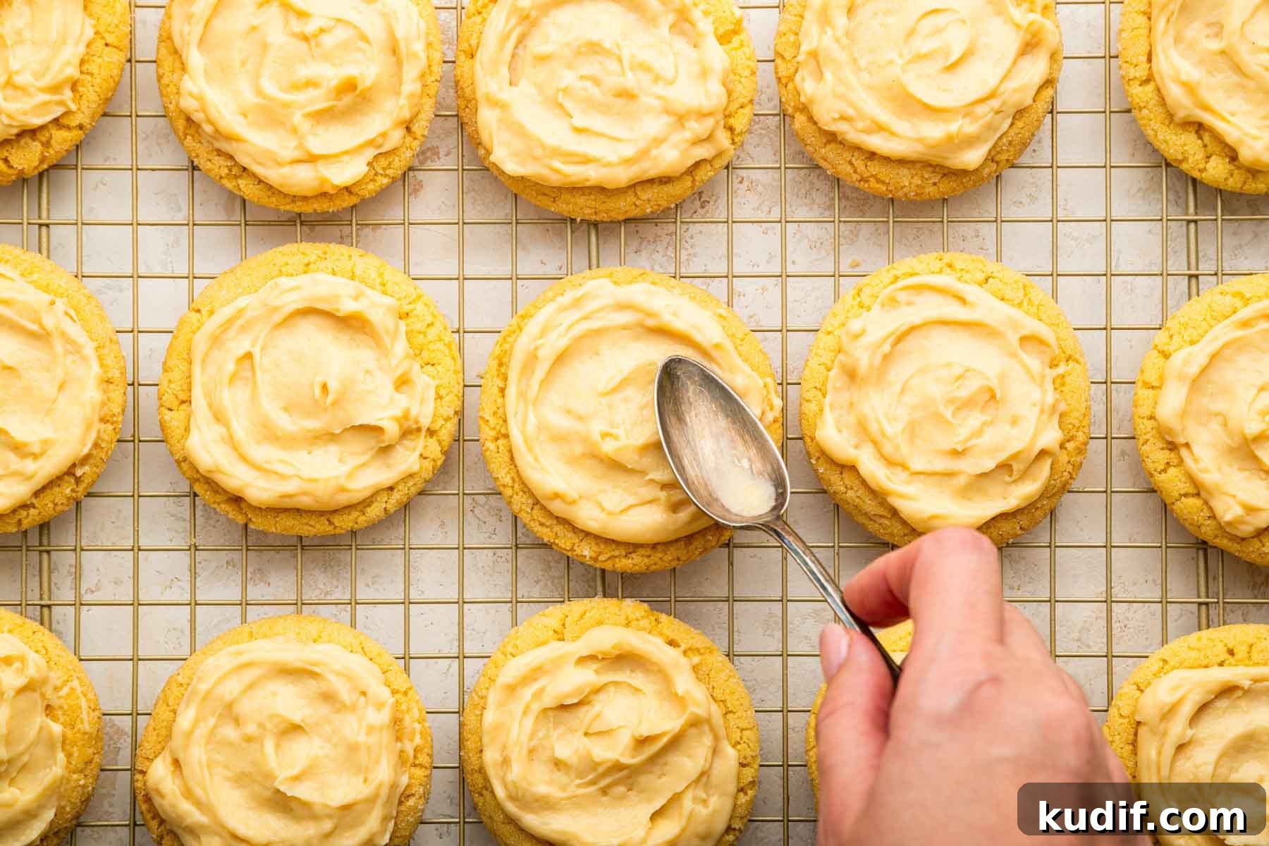 Crème Brûlée Cookie Recipe: Crispy Edges, Gooey Center 10 Hand spreading pudding on top of cookies.