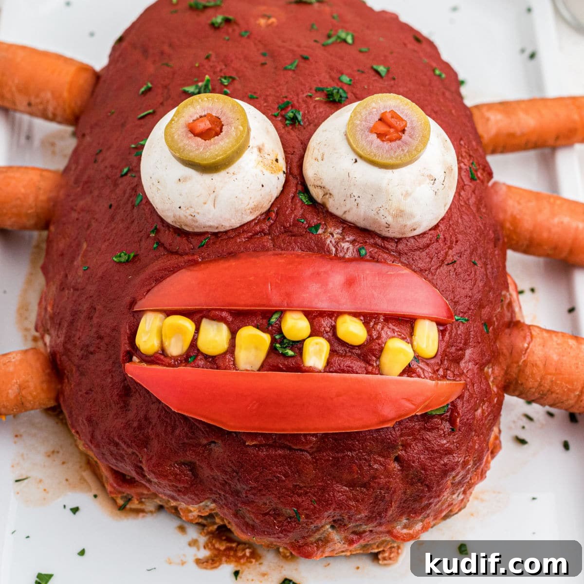 15 Spooky Halloween BBQ Recipes for Party-Worthy Grilling 10 Close up featured image of a monster meatloaf.