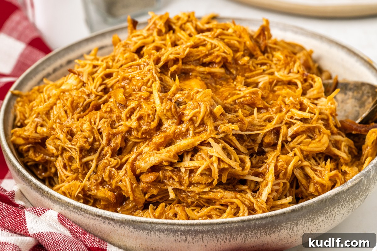 Bowl of shredded chicken.