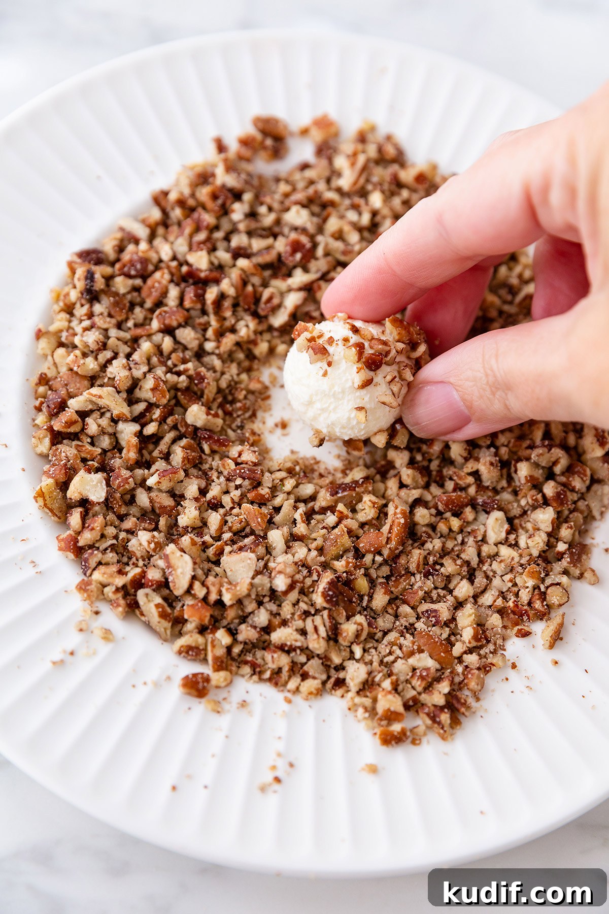 Festive Christmas Cheese Ball Wreath Recipe for Holiday Parties 4 Rolling Mini Cheese Balls in Chopped Nuts