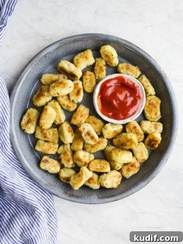 Veggie tots on a blue platter.