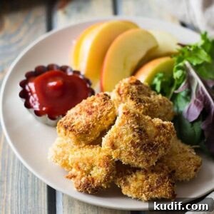 These Baked Homemade Chicken Nuggets are way better than the store bought and you can pronounce everything on these golden nuggets! | www.countrysidecravings.com