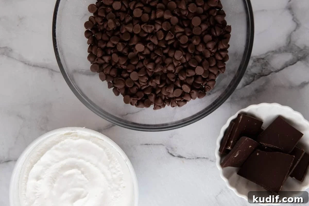Ingredients for cool whip candy including whipped topping, milk chocolate chips, and dark chocolate.