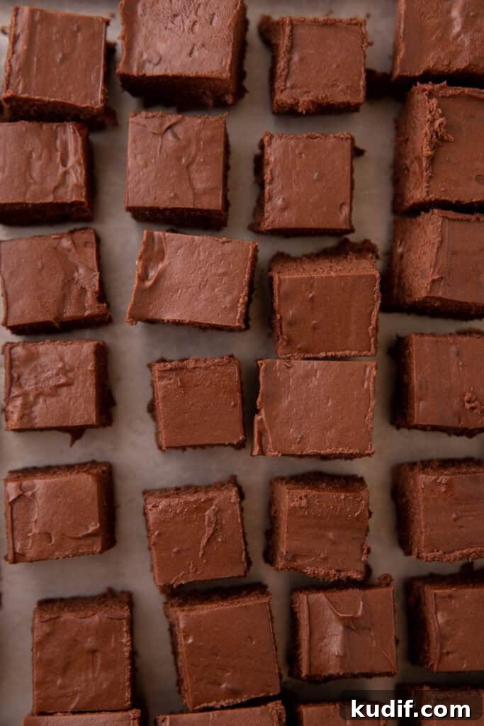 Squares of chilled chocolate filling cut and ready for dipping.