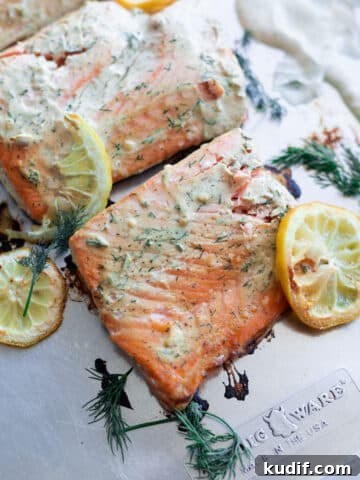 Baked salmon with dill sauce.