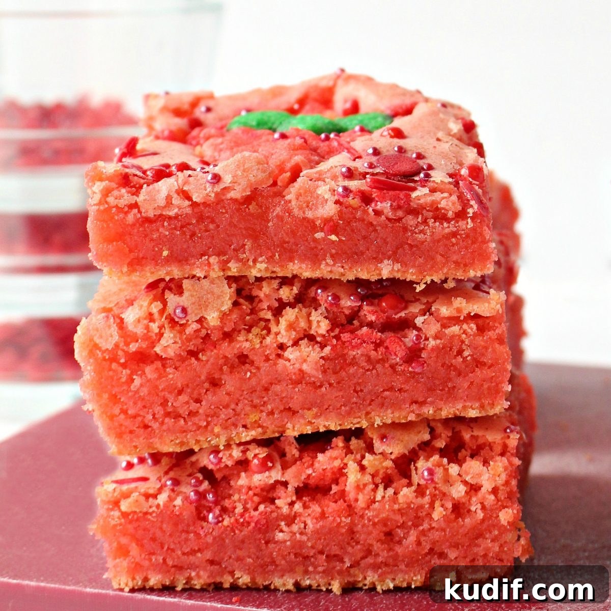 Decadent Strawberry Swirl Brownies: Chocolate & Fresh Berry Recipe 3 Stack of three bright pink, strawberry brownies.