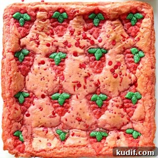 Decadent Strawberry Swirl Brownies: Chocolate & Fresh Berry Recipe 7 Uncut pan of pink Strawberry Brownies with Strawberry Press Cookies baked on top