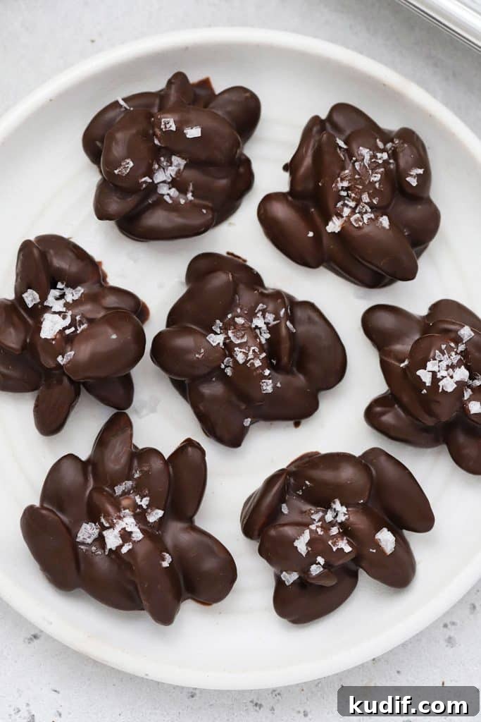 Chocolate almond clusters on a white plate