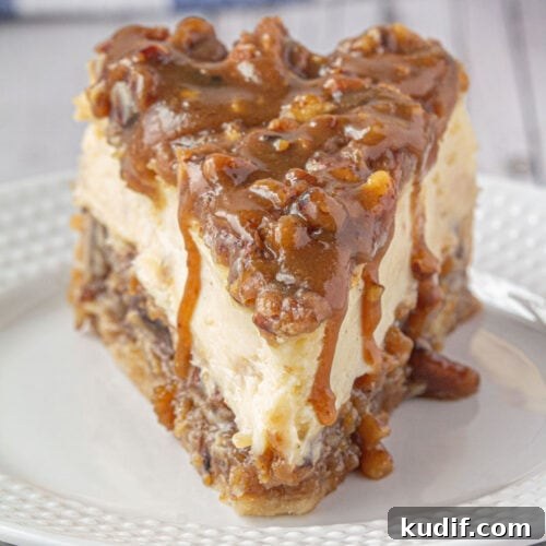 Closeup of pecan pie cheesecake on a plate.