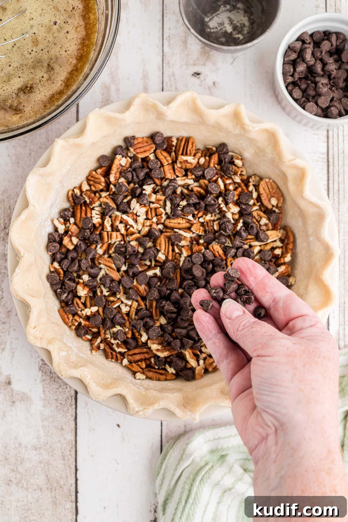 Decadent Chocolate Bourbon Pecan Pie Recipe 6 Chocolate and pecans in the bottom of an unbaked pie crust.
