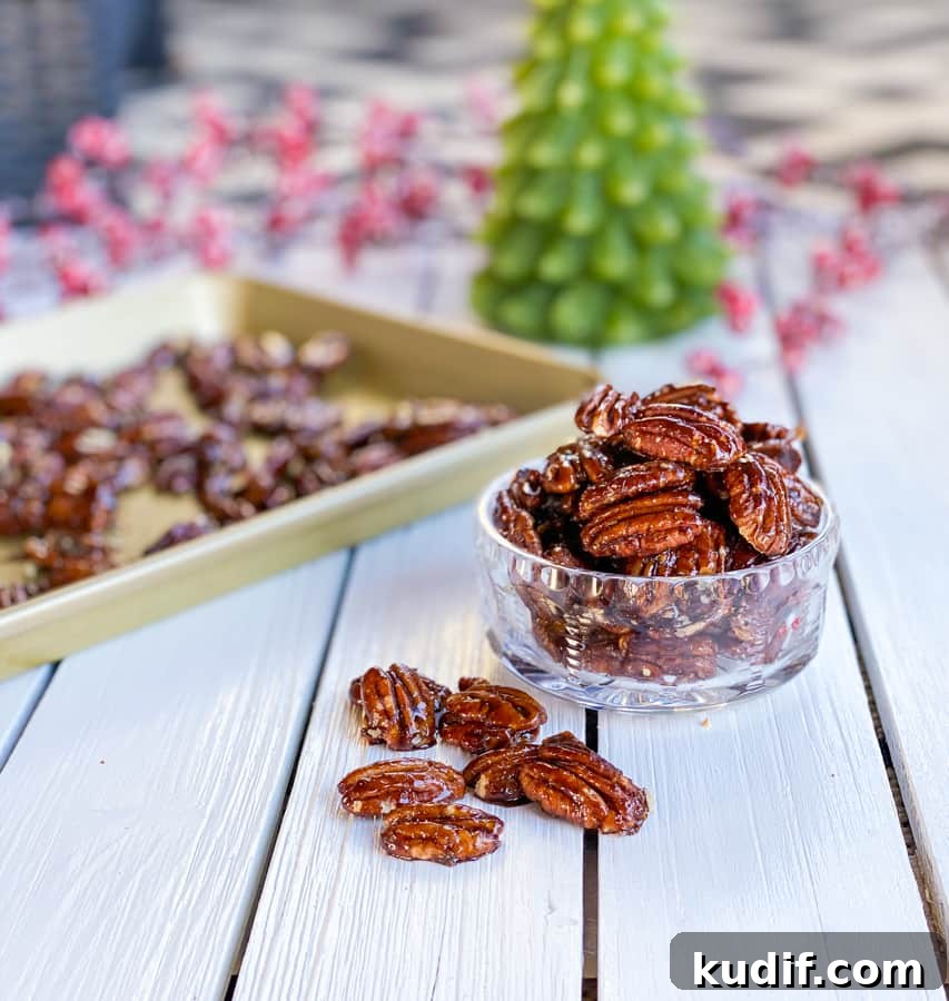 Brown Sugar Candied Pecans: Sweet & Crunchy Snack Recipe 4 Glazed candied pecans in a glass bowl on table.