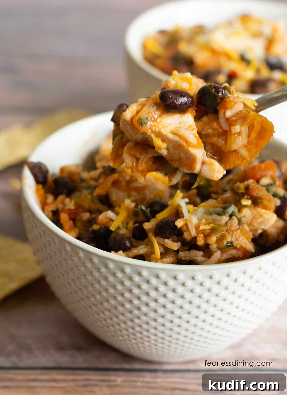 30-Minute Salsa Chicken Skillet Recipe for Quick Weeknight Dinners 2 A spoon holding up a bite of the salsa chicken skillet.