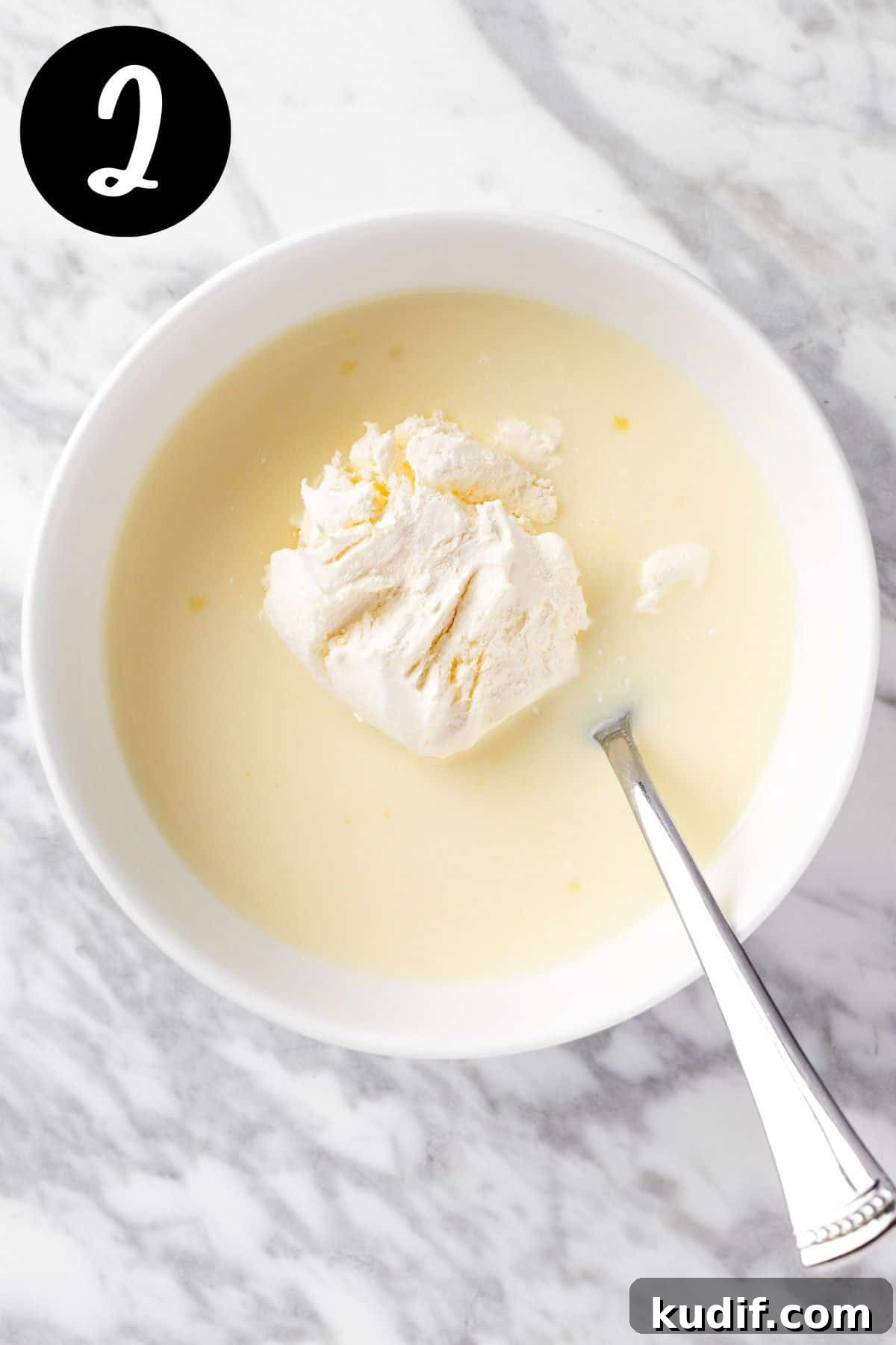 Creamy Vanilla Pudding Shots Recipe for Parties 5 Folding the cool whip into the pudding mixture.